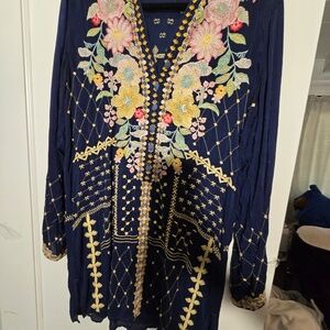 Johnny was    heavily embroidered  tunic or  dress